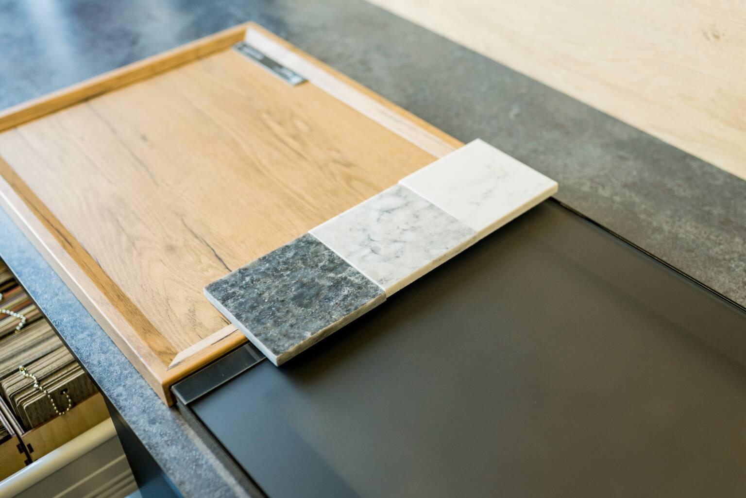Designer choosing kitchen cabinet material details in Malaysia