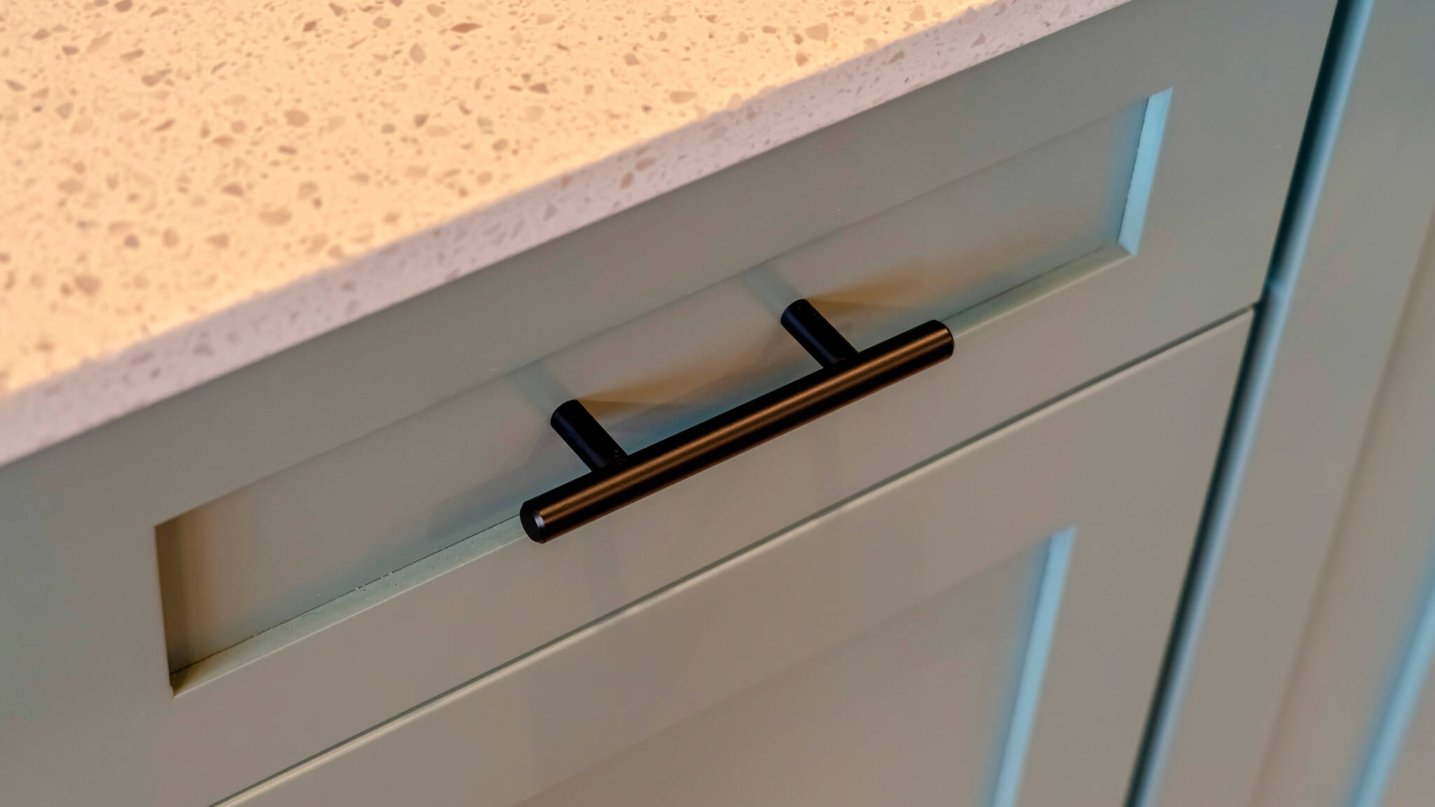 Close up of kitchen utensil drawer under cabinet showing organised functionality