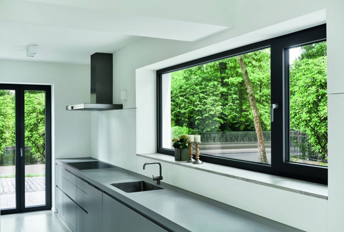 Malaysian wet kitchen with tiled walls, stainless steel fixtures and proper ventilation