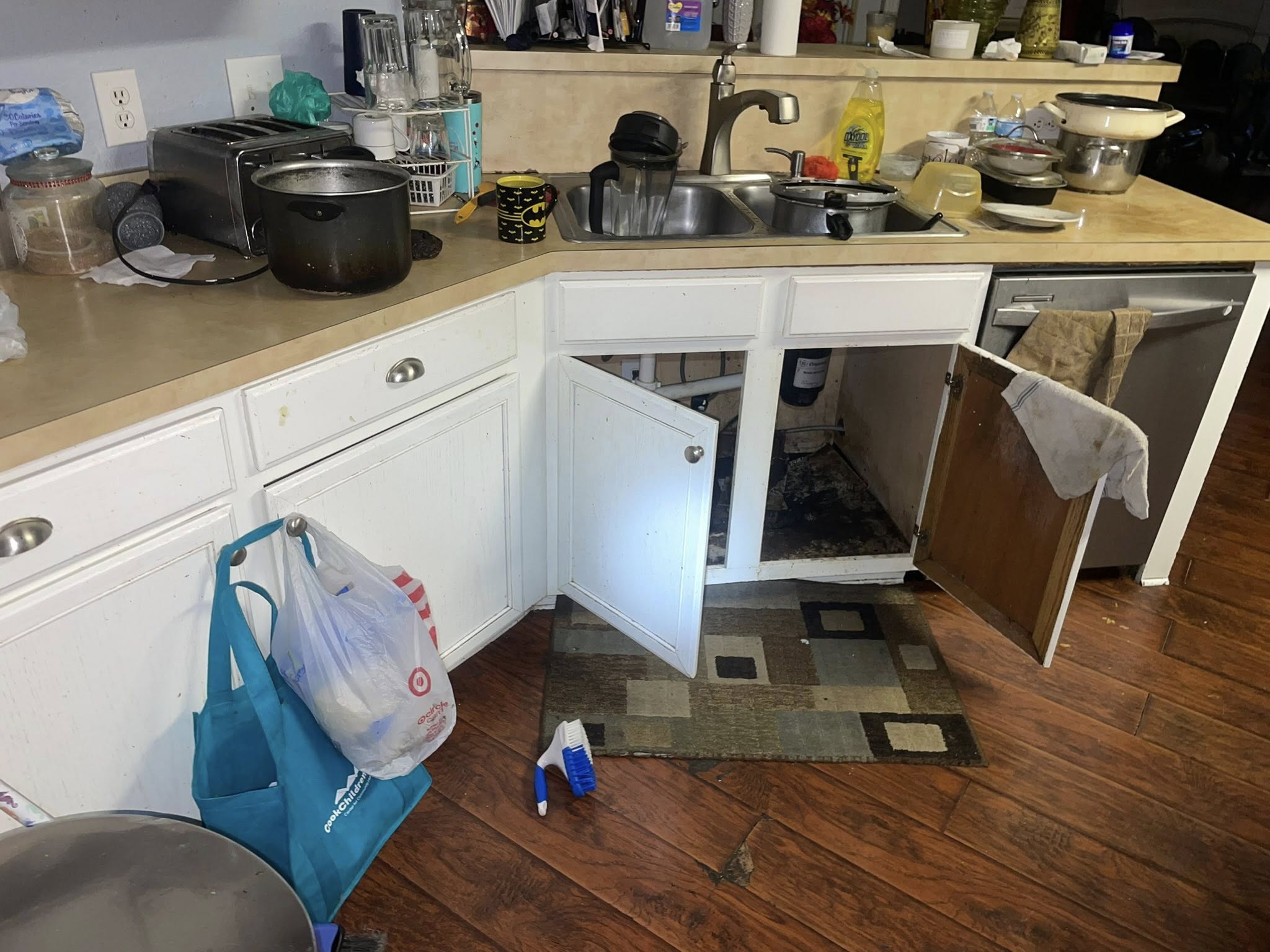 Old cabinets and tiles cleared during kitchen demolition in Malaysian home